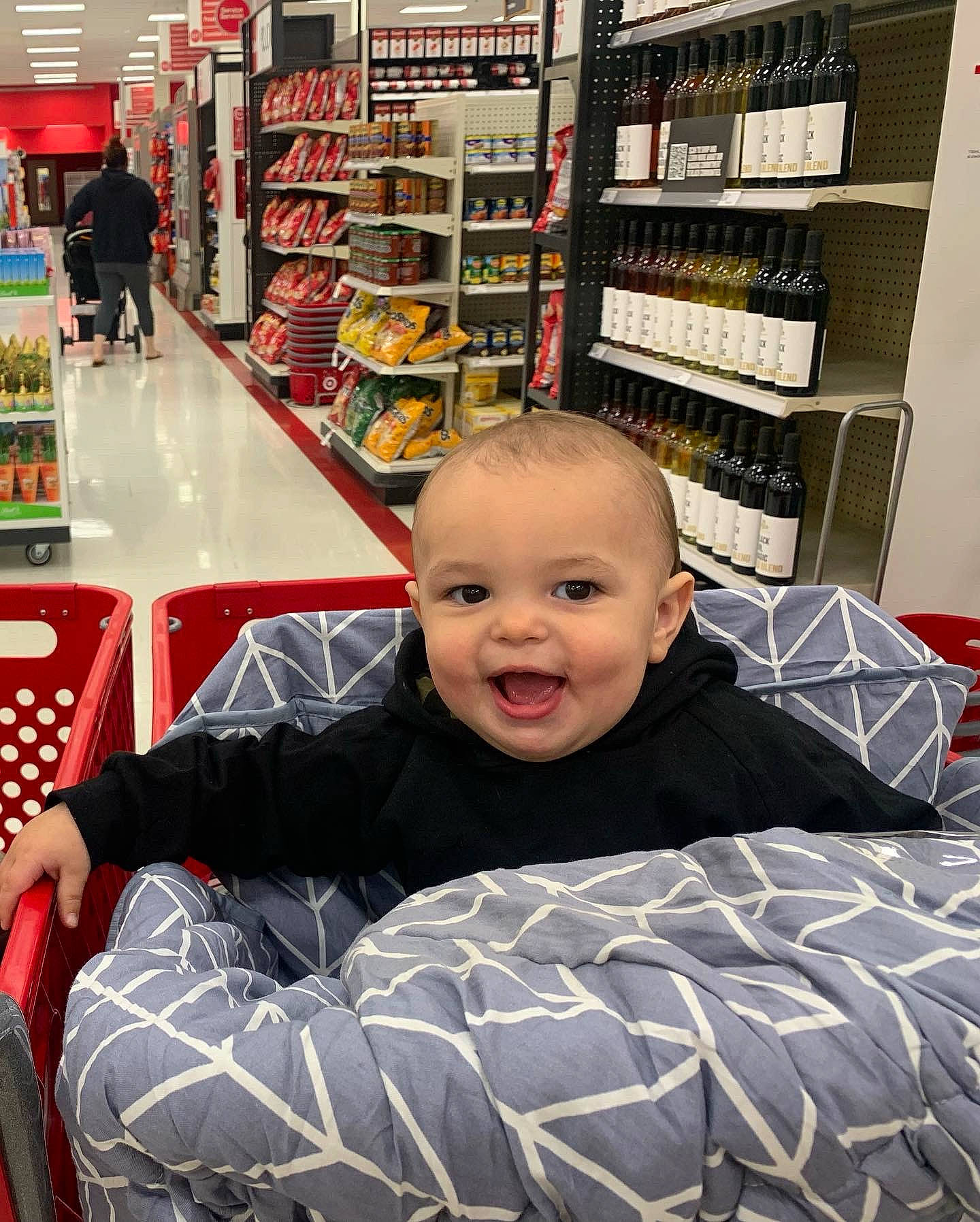 Levi is registered to the contest to win money with this photo: baby, baby_toddler_clothing, child, comfort, convenience_store, customer, fun, grocery_store, happy, person, product, retail, room, service, shelf, shelving, shopping, shopping_cart, sitting, smile