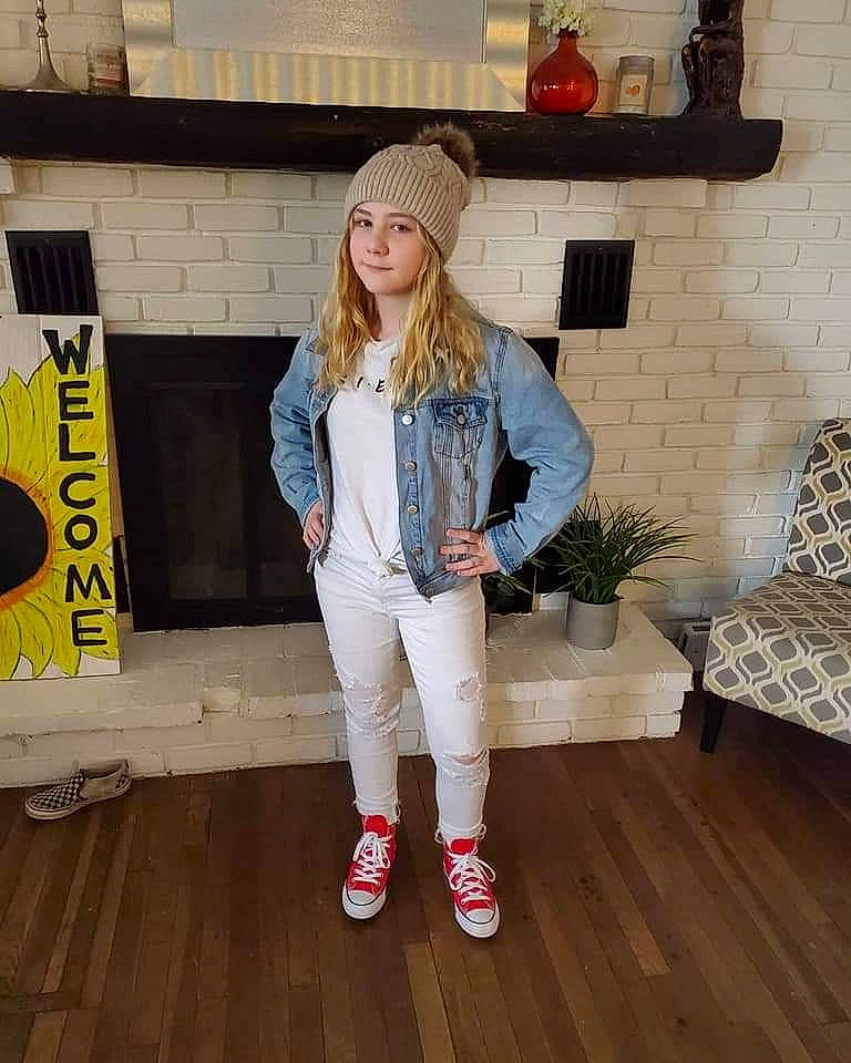 Emma is registered to the contest to win money with this photo: blazer, cap, cool, denim, eyewear, fashion_design, flooring, hardwood, hat, headgear, headwear, human_leg, knee, orange, person, shoe, sleeve, street_fashion, textile, thigh