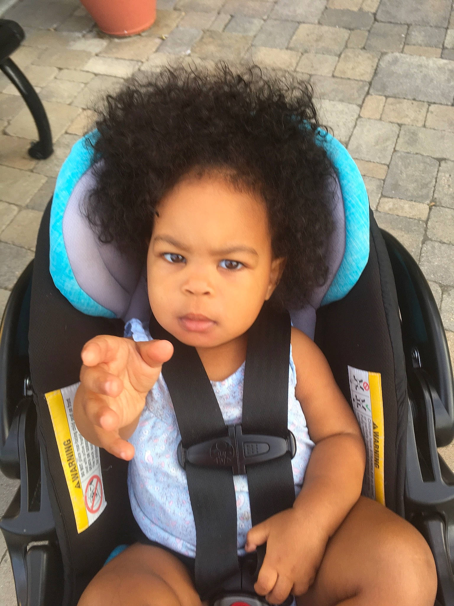 Emarie is registered to the contest to win money with this photo: black_hair, car_seat, child, girl, hair, hairstyle, person, product, toddler