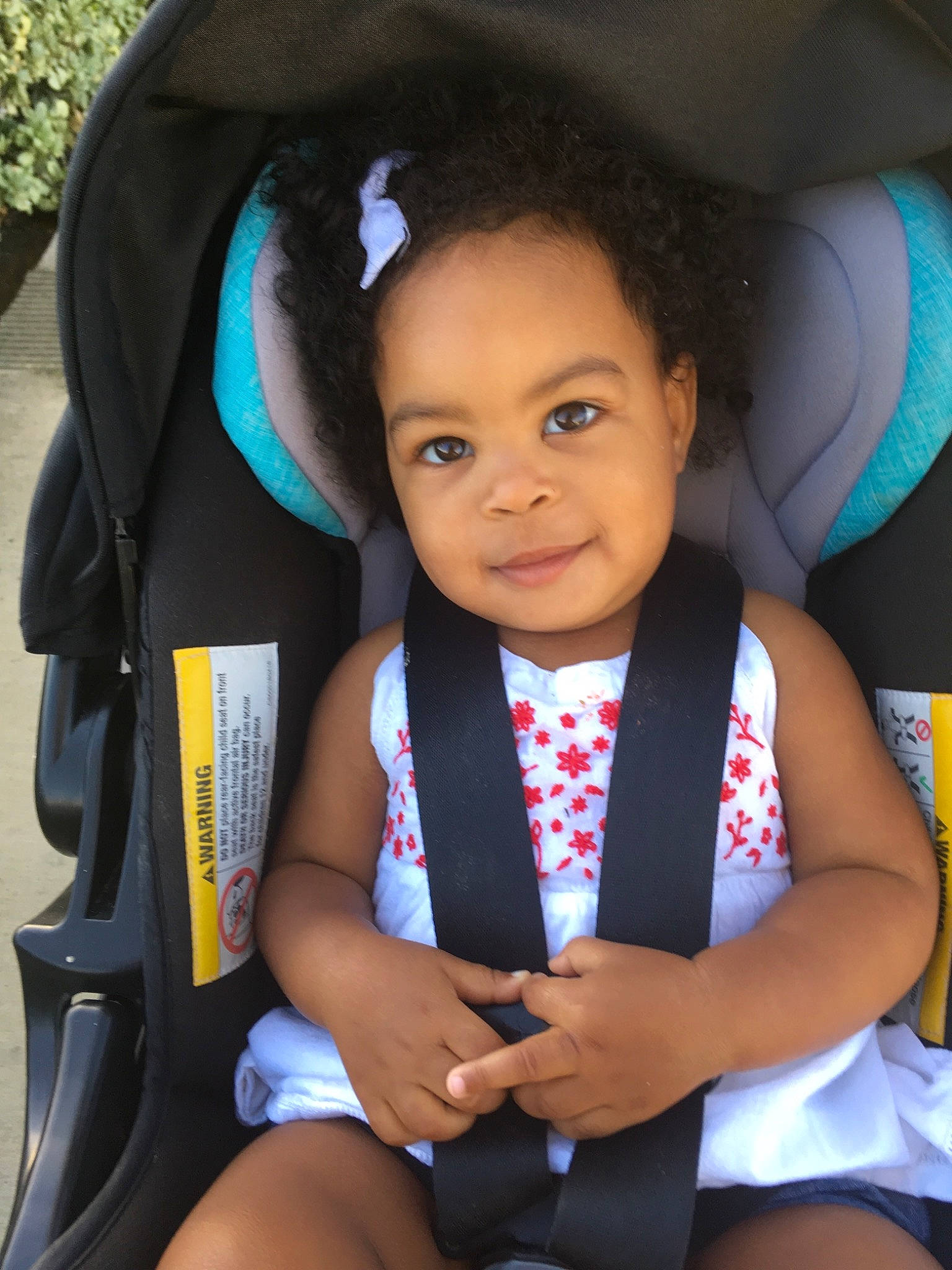 Emarie is registered to the contest to win money with this photo: baby_products, black_hair, car_seat, child, day, girl, infant, person, product, smile, toddler