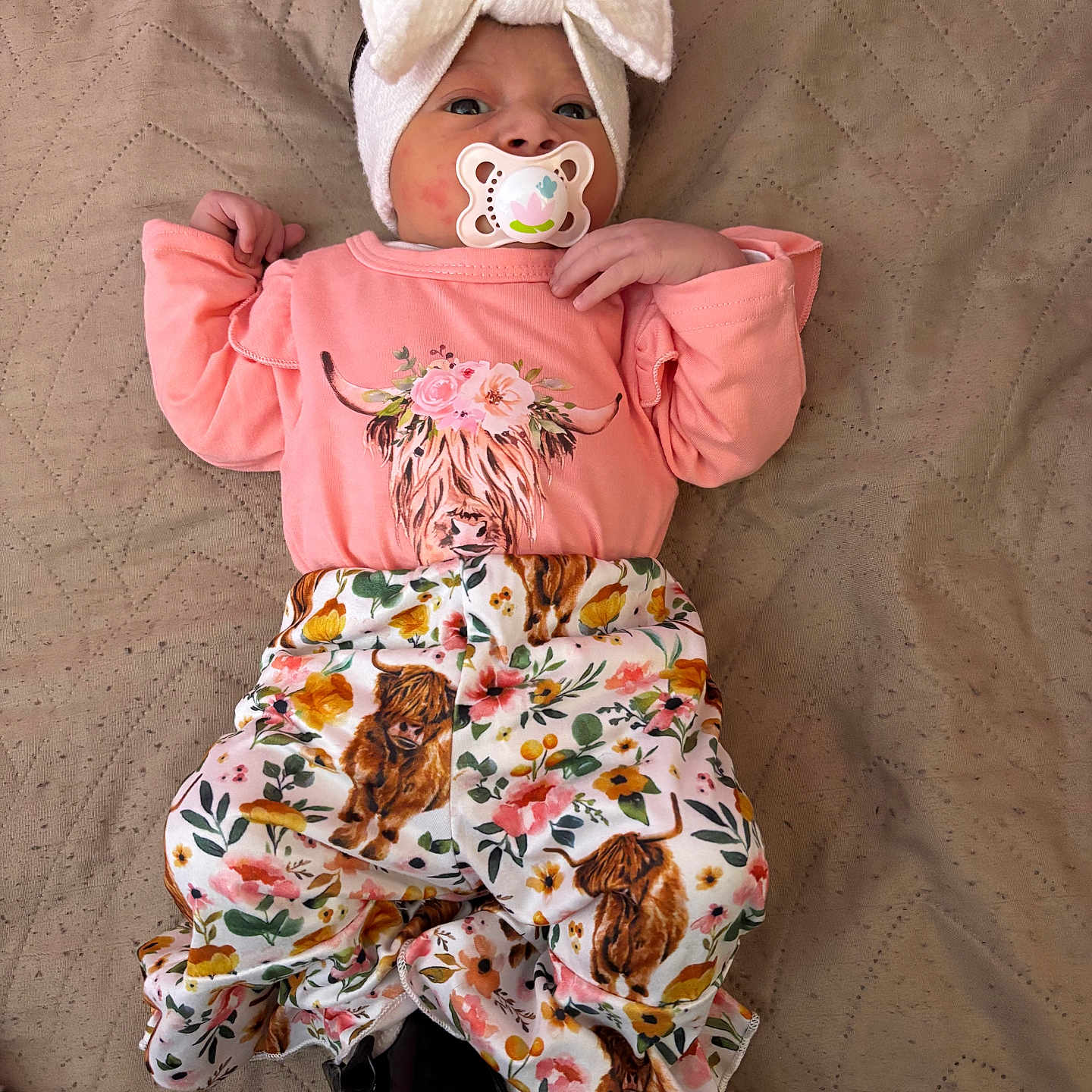 Sianna joined the competition — help win amazing prizes! baby, blanket, bodypart, bonnet, cap, clothing, couch, dress, face, finger, furniture, hand, happy, hat, head, person, photography, portrait, sitting, smile