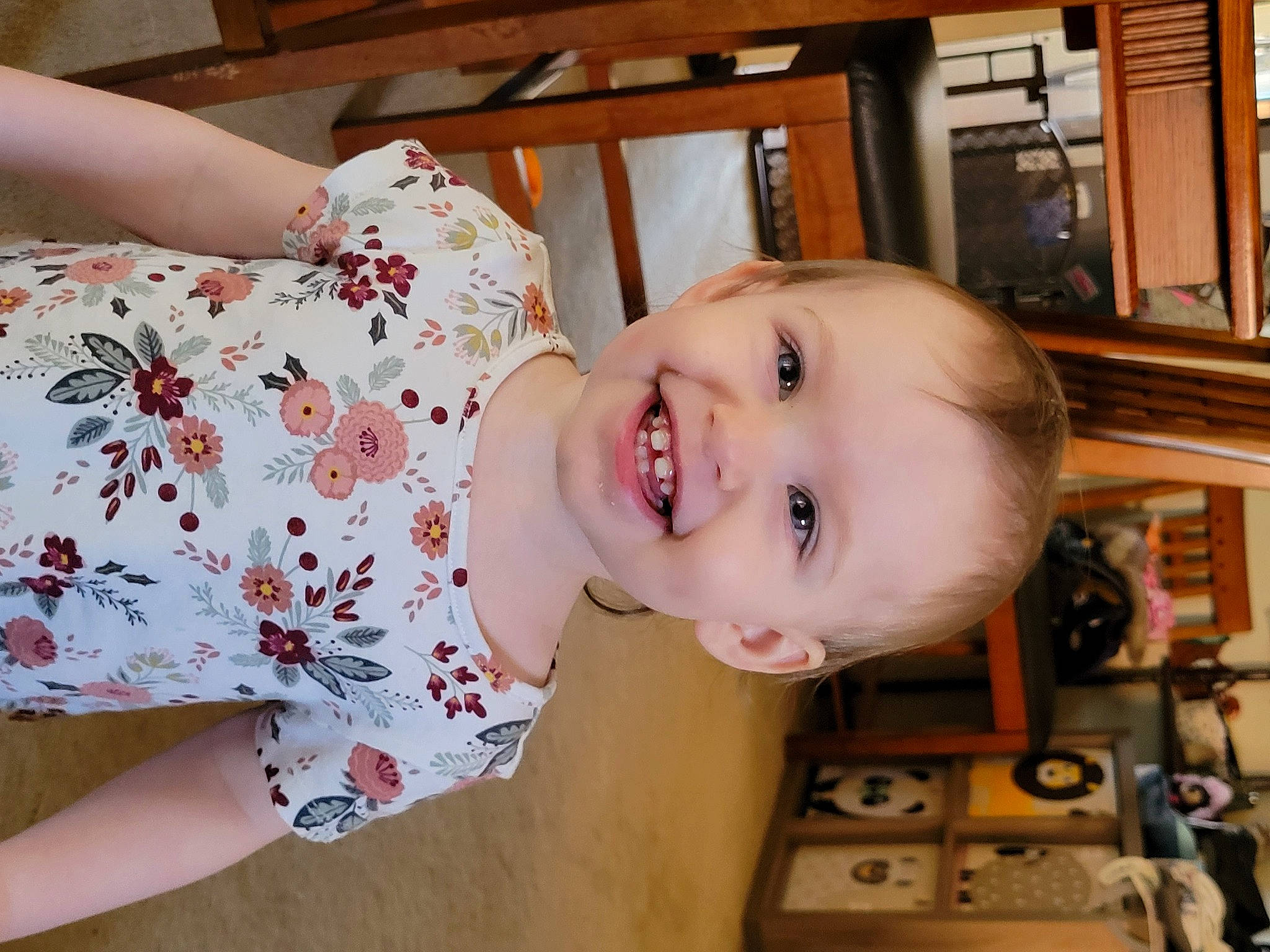 Andrea is registered to the contest to win money with this photo: baby, baby_laughing, baby_toddler_clothing, cheek, child, eye, finger, fun, happy, human_body, human_leg, joy, mouth, nose, pattern, person, room, skin, smile, thigh