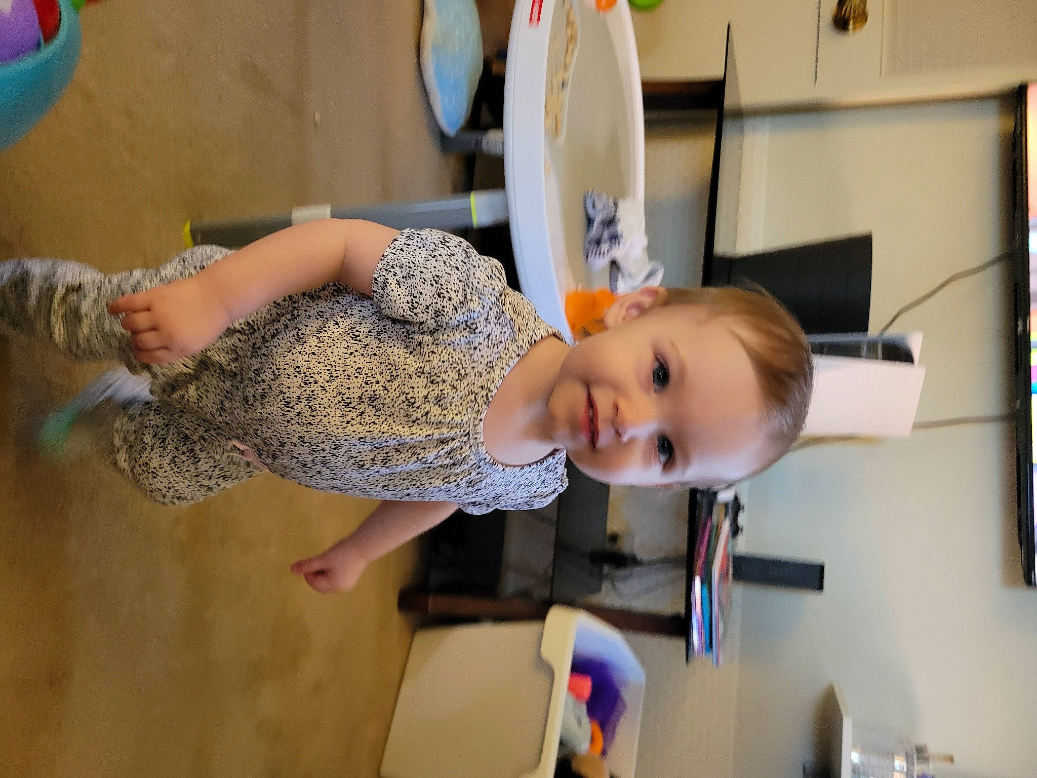 Andrea is registered to the contest to win money with this photo: baby, baby_products, child, drawer, flooring, fun, hairstyle, home_appliance, human_leg, joy, kitchen, knee, machine, person, refrigerator, room, sandal, shoulder, smile, standing