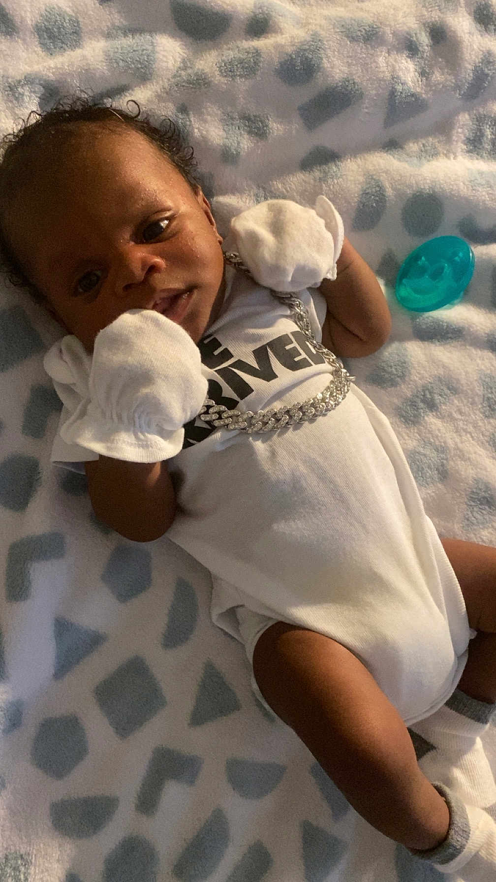 Khavari Williams is registered to the contest to win money with this photo: baby, bed, blanket, bodypart, clothing, cushion, face, finger, furniture, glove, hand, head, homedecor, newborn, person, photography, portrait, quilt, sleeping, t_shirt