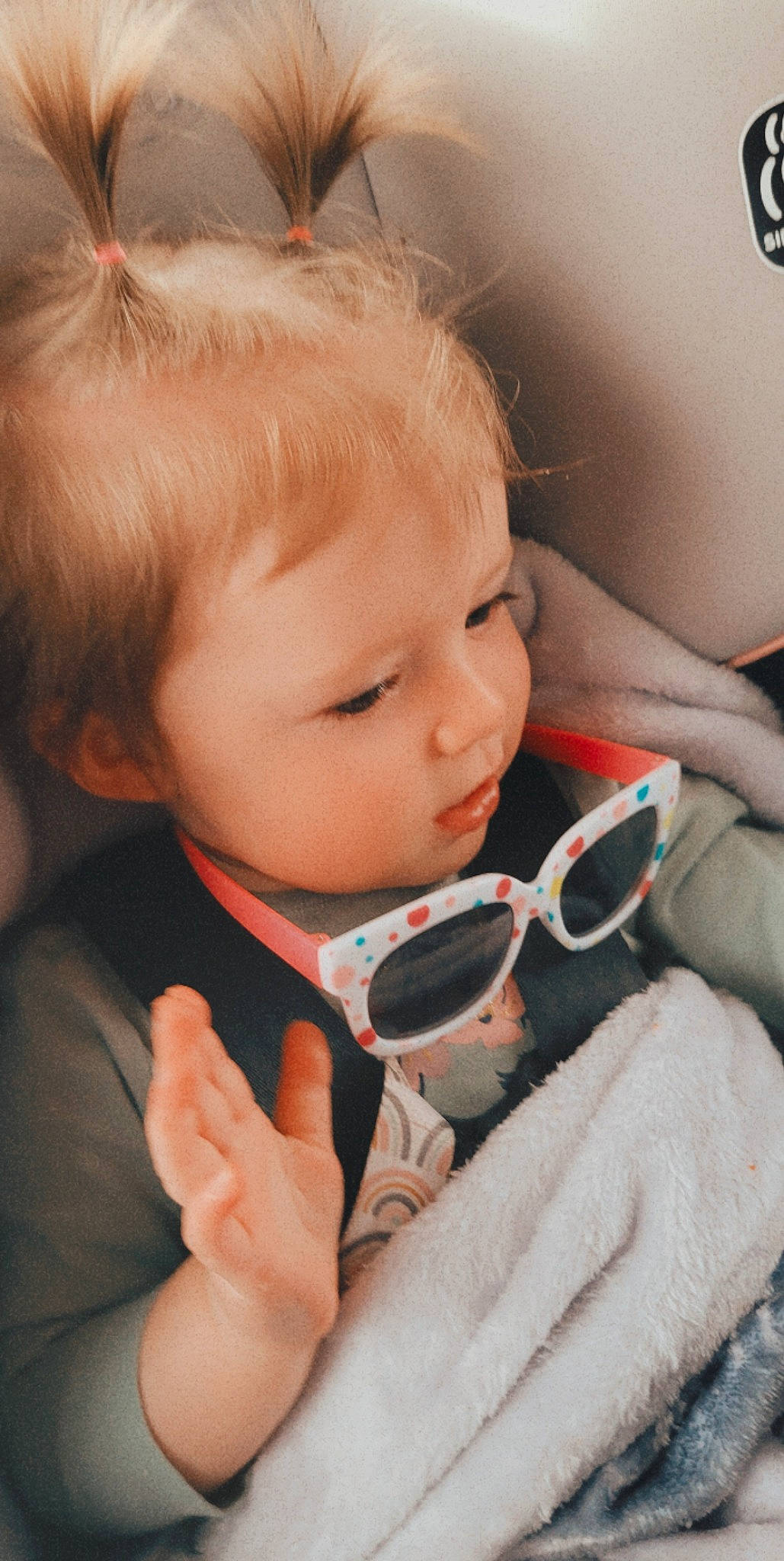 Scarlett is registered to the contest to win money with this photo: baby_toddler_clothing, cheek, chin, ear, eyebrow, eyelash, eyewear, face, finger, gesture, hair, hand, iris, lip, mouth, nose, organ, person, skin, sunglasses