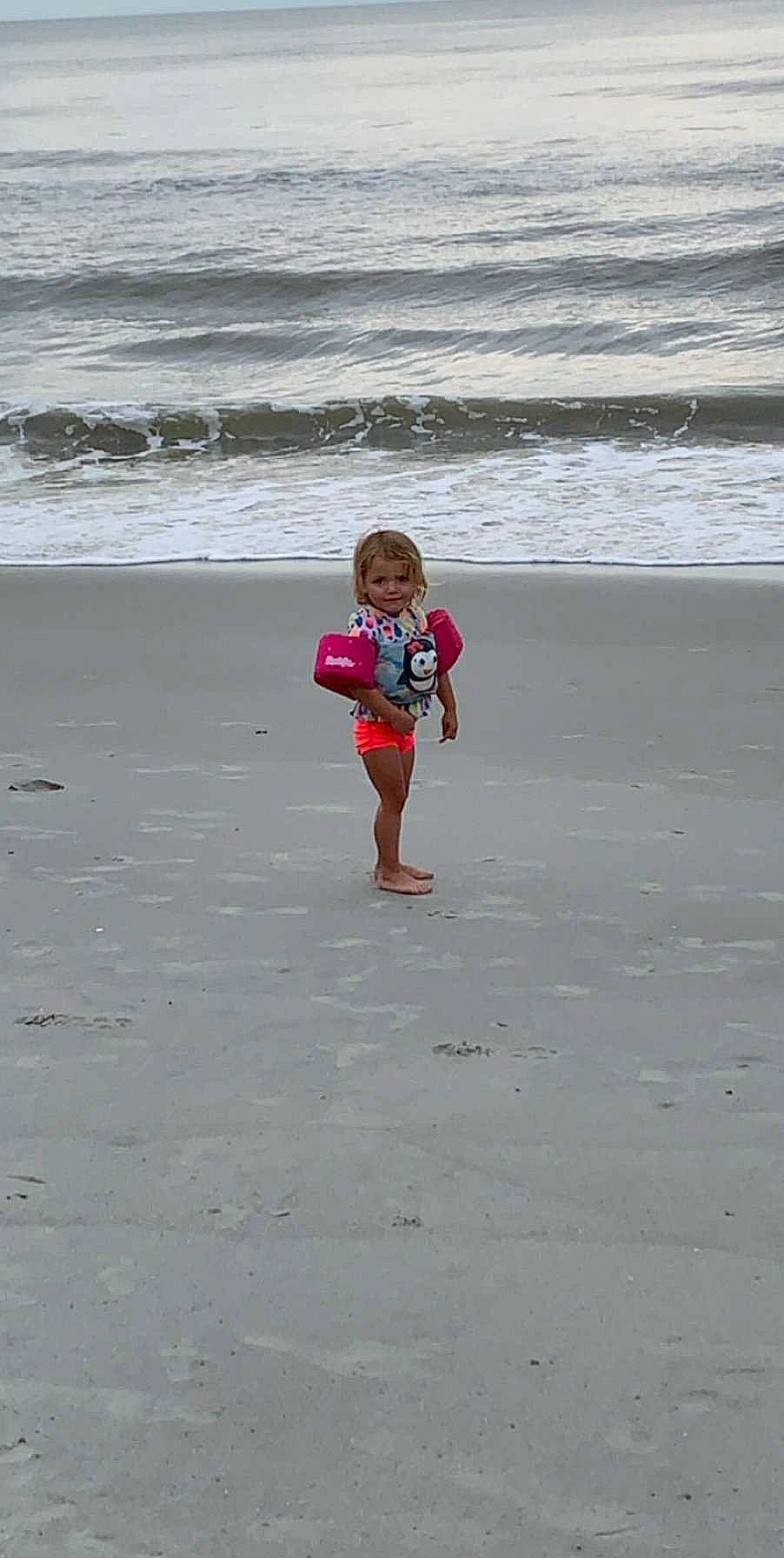 Holland is registered to the contest to win money with this photo: beach, child, coast, fun, ocean, person, play, sand, sea, shore, summer, vacation, wave