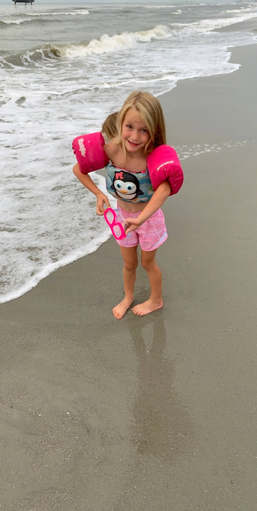 Halle is registered to the contest to win money with this photo: child, fun, joy, person, pink, play, toddler, vacation