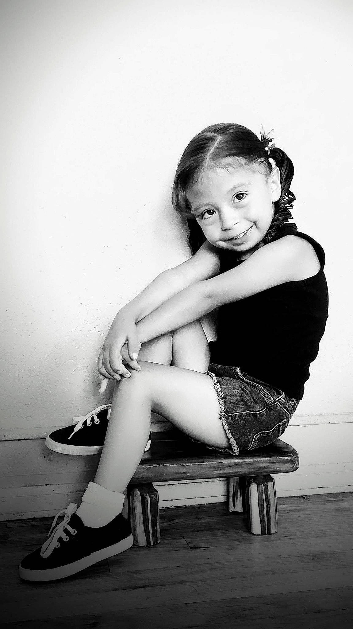 Ayanna is registered to the contest to win money with this photo: black, black_and_white, black_hair, eye, face, flash_photography, footwear, hair, happy, head, joy, knee, leg, monochrome, monochrome_photography, person, shoe, shorts, shoulder, sneakers