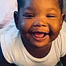 Sraeaah joined the competition — help win amazing prizes! baby, child, infant, smiling, laughing, portrait, face, pigtails, hair_bows, white_shirt, bed, blanket, bottle, indoor, close_up, happy, sitting, crawling, adorable, photography