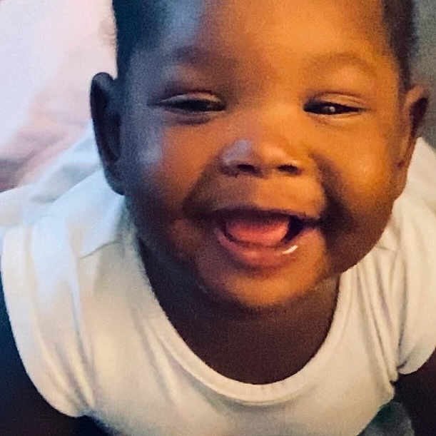 Sraeaah joined the competition — help win amazing prizes! adorable, baby, bed, blanket, bottle, child, close_up, crawling, face, hair_bows, happy, indoor, infant, laughing, photography, pigtails, portrait, sitting, smiling, white_shirt