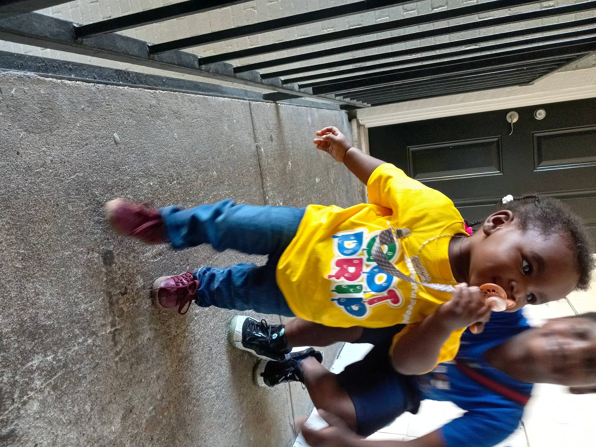 Aavanna is registered to the contest to win money with this photo: adventure, asphalt, child, concrete, fun, happy, leisure, person, play, player, recreation, shorts, sitting, t_shirt, toddler, vacation, world