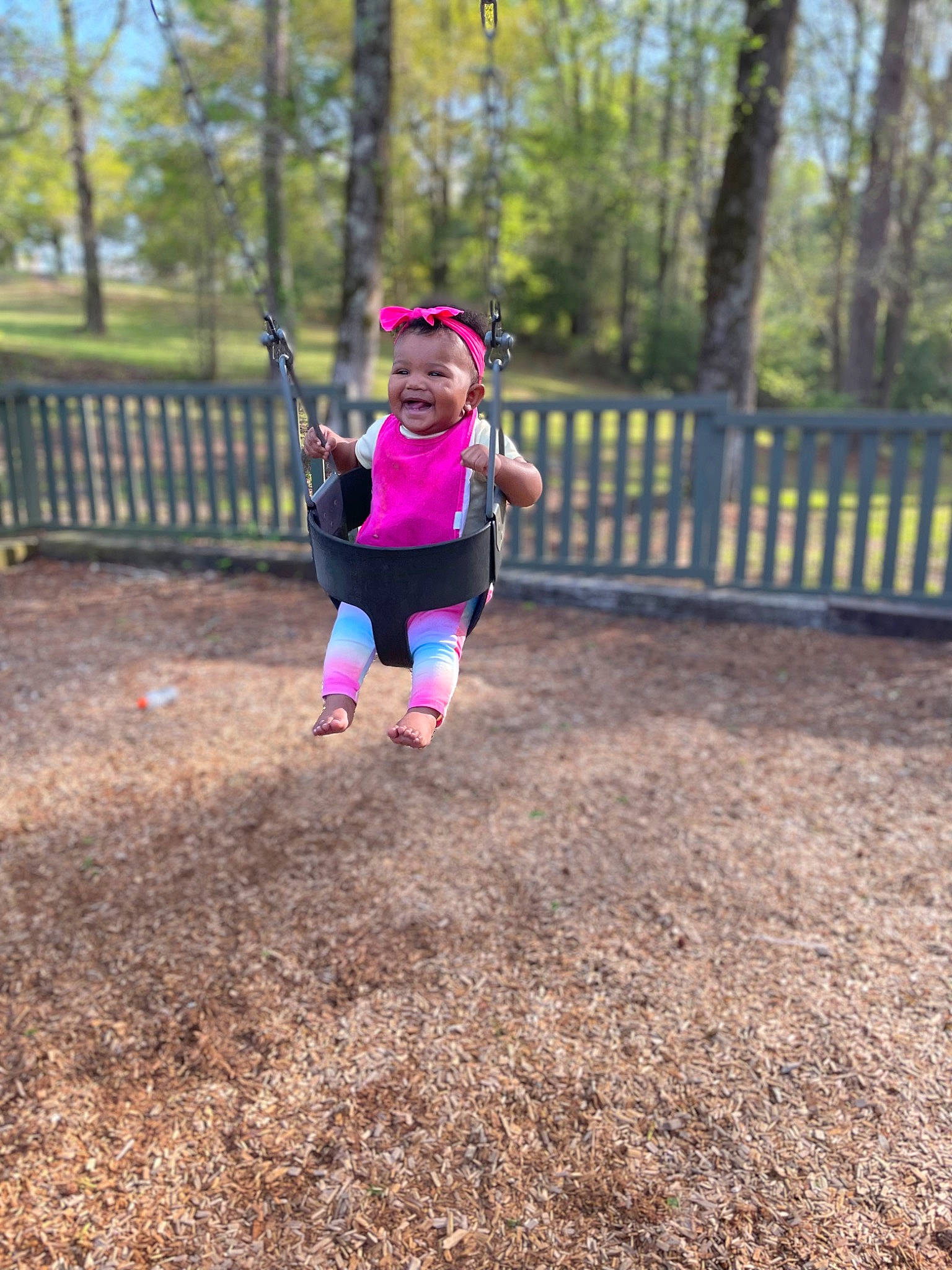 Aylah joined the competition — help win amazing prizes! asphalt, city, fence, forest, fun, grass, happy, hat, landscape, leisure, magenta, people_in_nature, person, plant, playground, recreation, running, shorts, swing, toddler