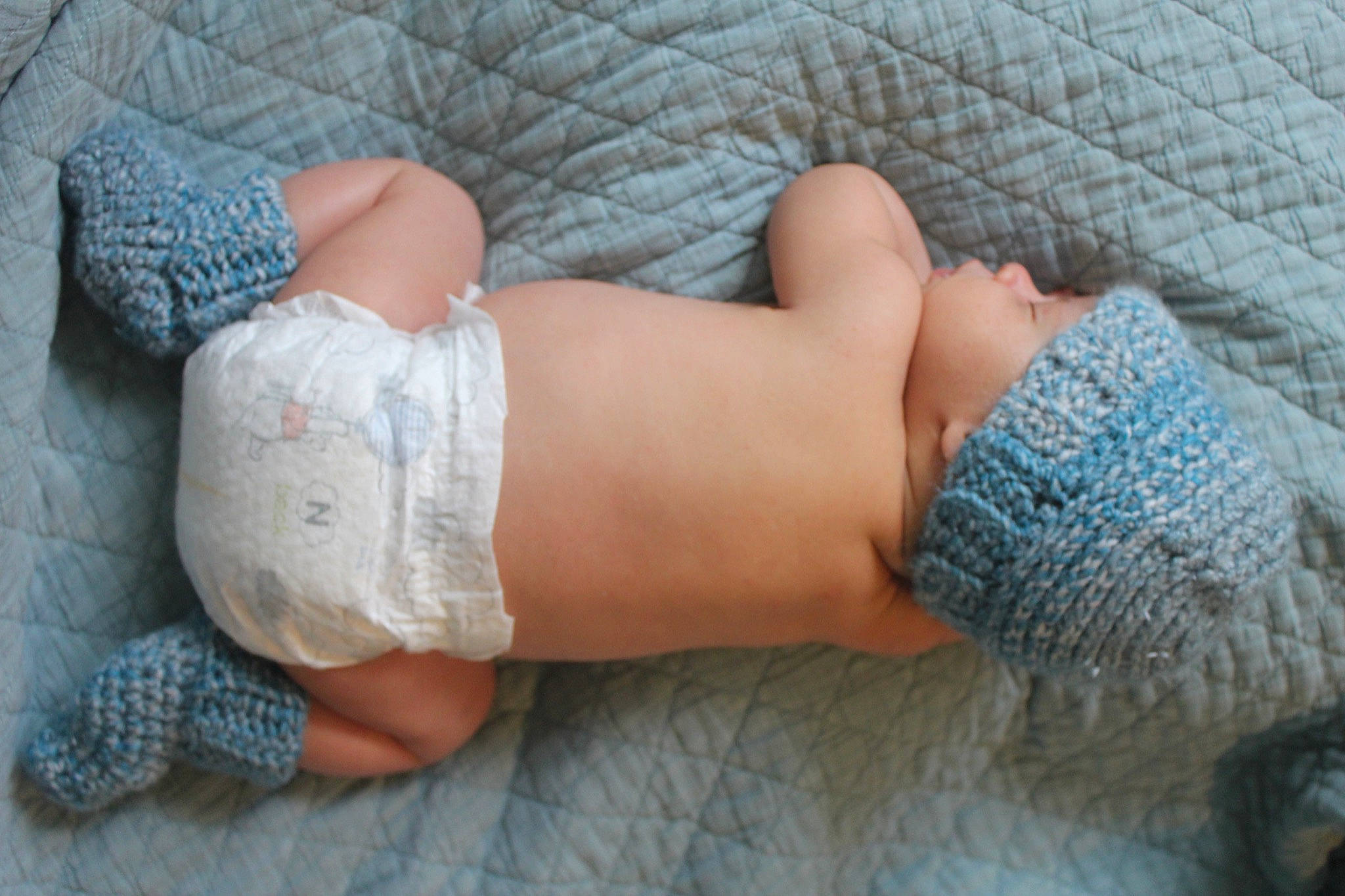 Konnor joined the competition — help win amazing prizes! baby, blue, child, crochet, finger, foot, hand, human_leg, knitting, leg, nap, person, sleep, toddler, toe, wool