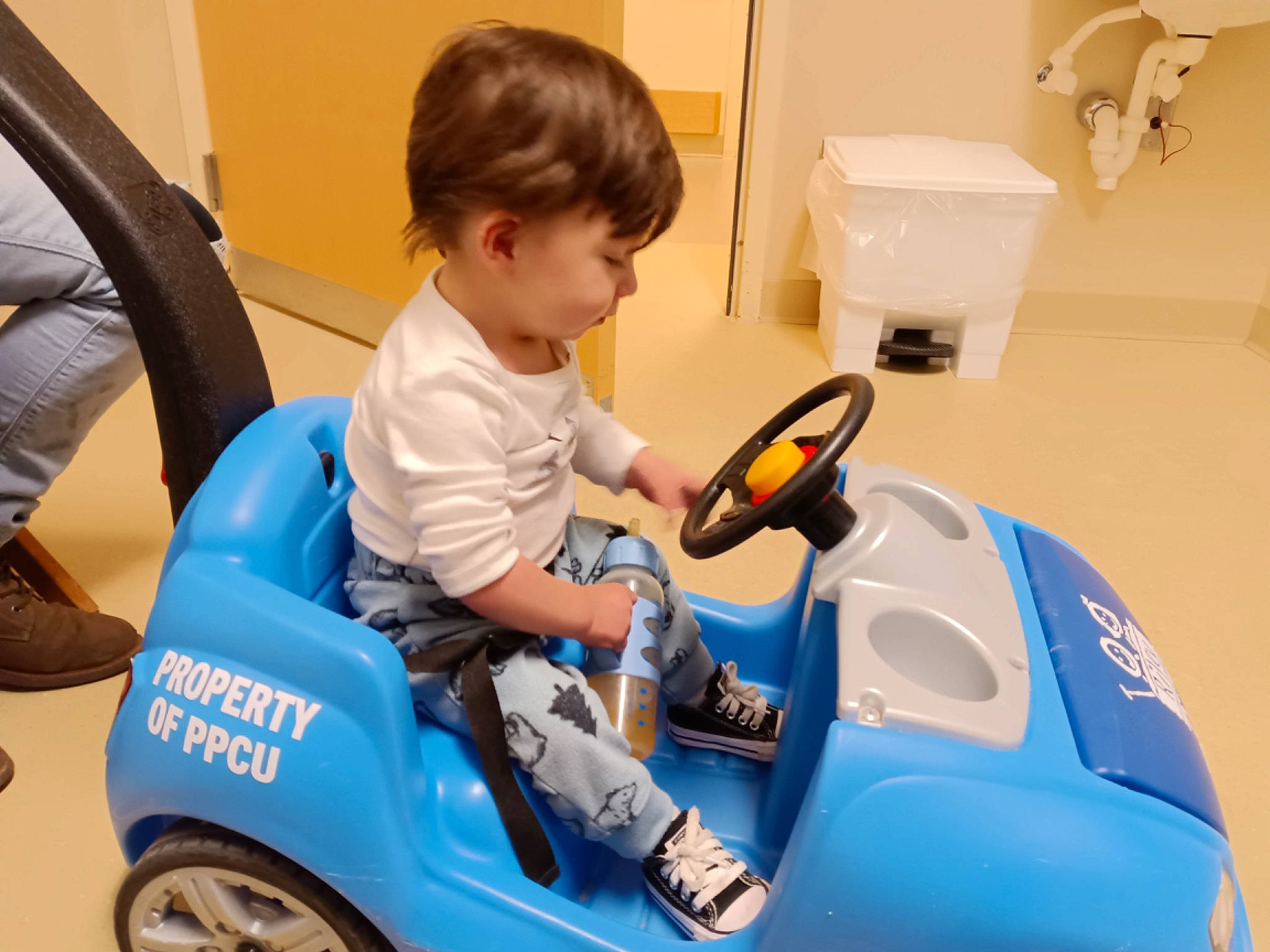 Vincent is registered to the contest to win money with this photo: automotive_design, automotive_tire, automotive_wheel_system, bathroom, chair, child, cleanliness, electric_blue, fender, household_supply, motor_vehicle, paper_towel, person, riding_toy, tire, toddler, toilet_paper, toy, toy_vehicle, vehicle