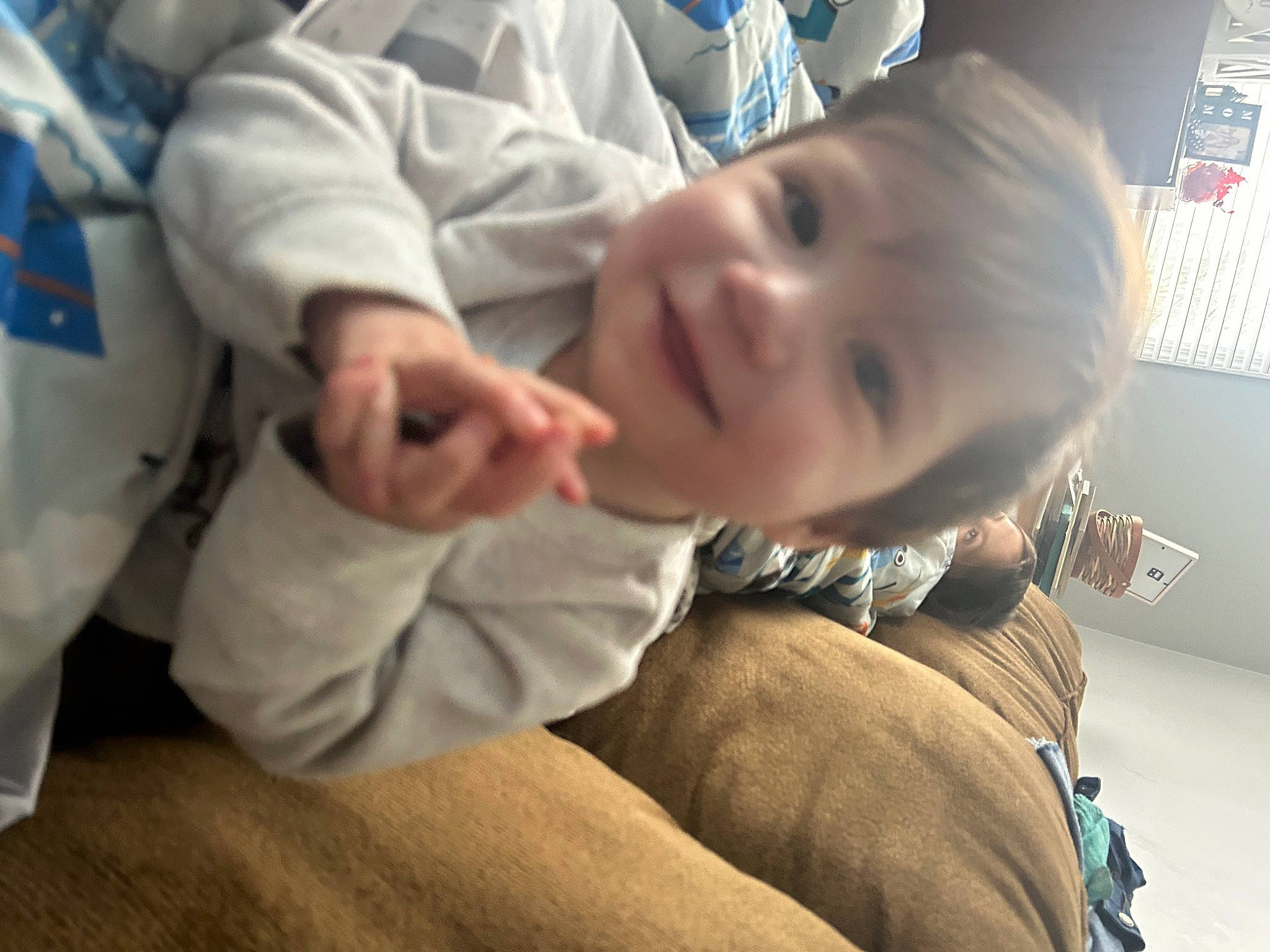 Vincent is registered to the contest to win money with this photo: baby, baby_products, baby_toddler_clothing, cheek, child, comfort, elbow, flooring, fun, gesture, happy, hardwood, joy, person, room, sitting, sleeve, smile, thumb, toddler