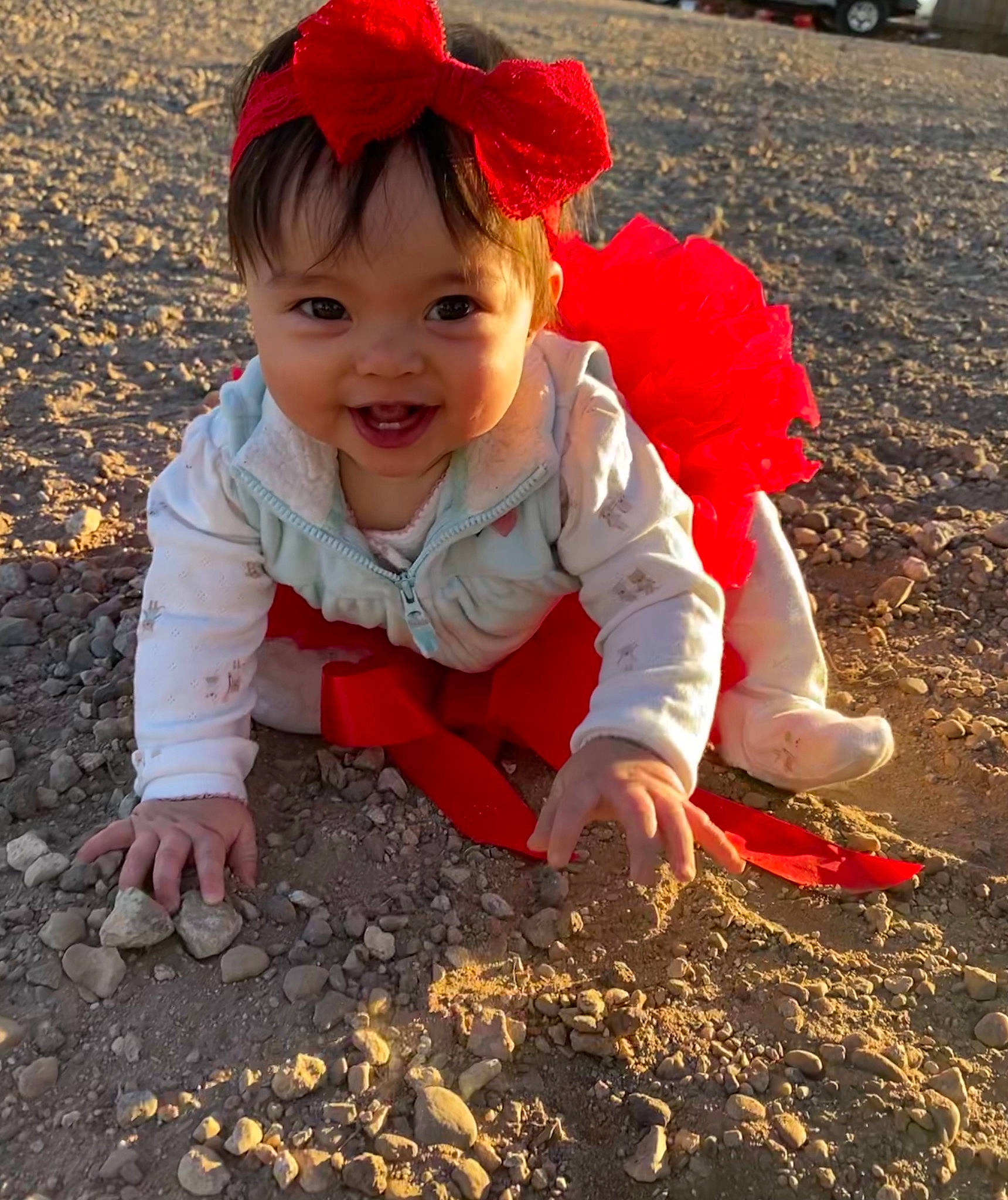 Deborah joined the competition — help win amazing prizes! baby, baby_laughing, baby_toddler_clothing, child, costume_accessory, eye, face, fish, headwear, joy, mouth, nose, person, play, red, sand, soil, toddler, vehicle_registration_plate