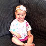 baby, child, smile, headband, bow, tshirt, nike, pink, shorts, sitting, couch, furniture, indoors, happy, cute, person, skin, foot, hand, face