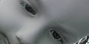 Jackson is registered to the contest to win money with this photo: child, face, close_up, black_and_white, outdoor, curious, expression, portrait, young, head, person, eye, nose, mouth, skin, monochrome, blurred_background, metal_pole, tilted, photo