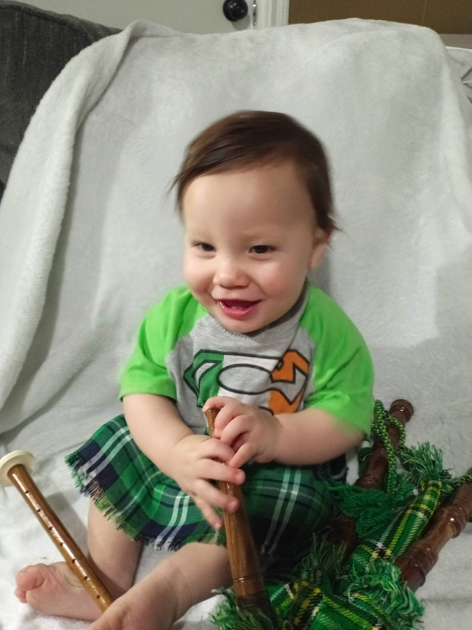 Timmy is registered to the contest to win money with this photo: baby, baby_toddler_clothing, black, cheek, clothing, eye, finger, green, hairstyle, head, joy, person, photograph, product, shorts, skin, sleeve, smile, standing, t_shirt