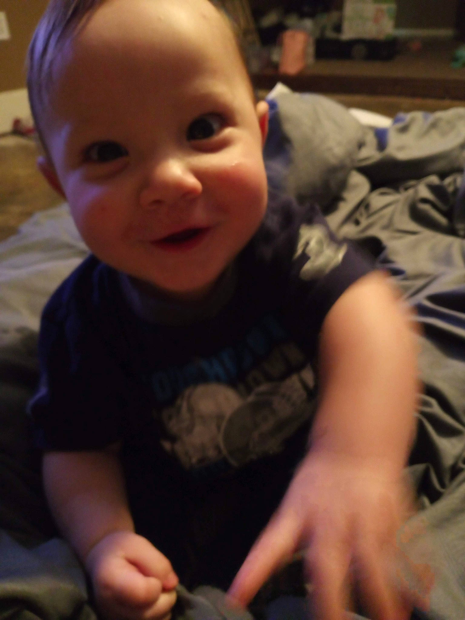 Timmy joined the competition — help win amazing prizes! baby_toddler_clothing, black, cheek, chin, cloud, eye, finger, happy, head, human_body, iris, light, mammal, mouth, nose, person, skin, sleeve, smile, thumb