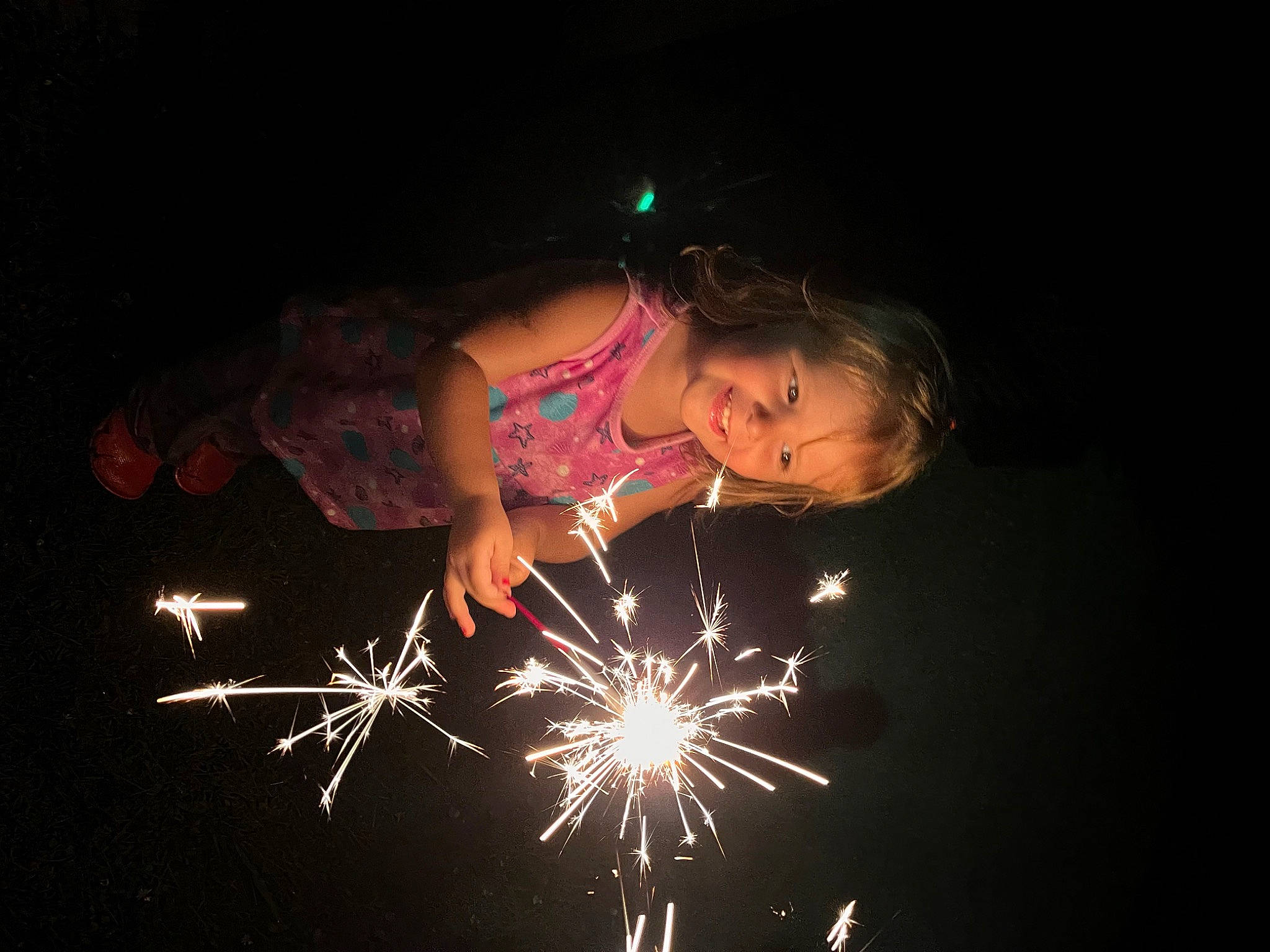 Emalee is registered to the contest to win money with this photo: beauty, darkness, diwali, electric_blue, entertainment, event, festival, fireworks, flash_photography, fun, holiday, joy, midnight, new_year, new_years_day, night, person, public_event, recreation, shorts