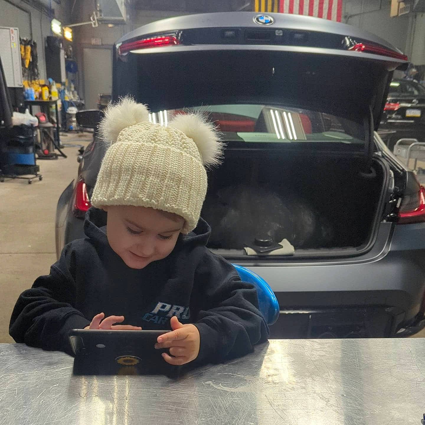 Addilyn is registered to the contest to win money with this photo: auto_part, automotive_design, automotive_exterior, automotive_lighting, automotive_tail_brake_light, automotive_tire, automotive_wheel_system, bumper, cap, car, headwear, motor_vehicle, parking, person, personal_luxury_car, snapshot, technology, toddler, travel, trunk