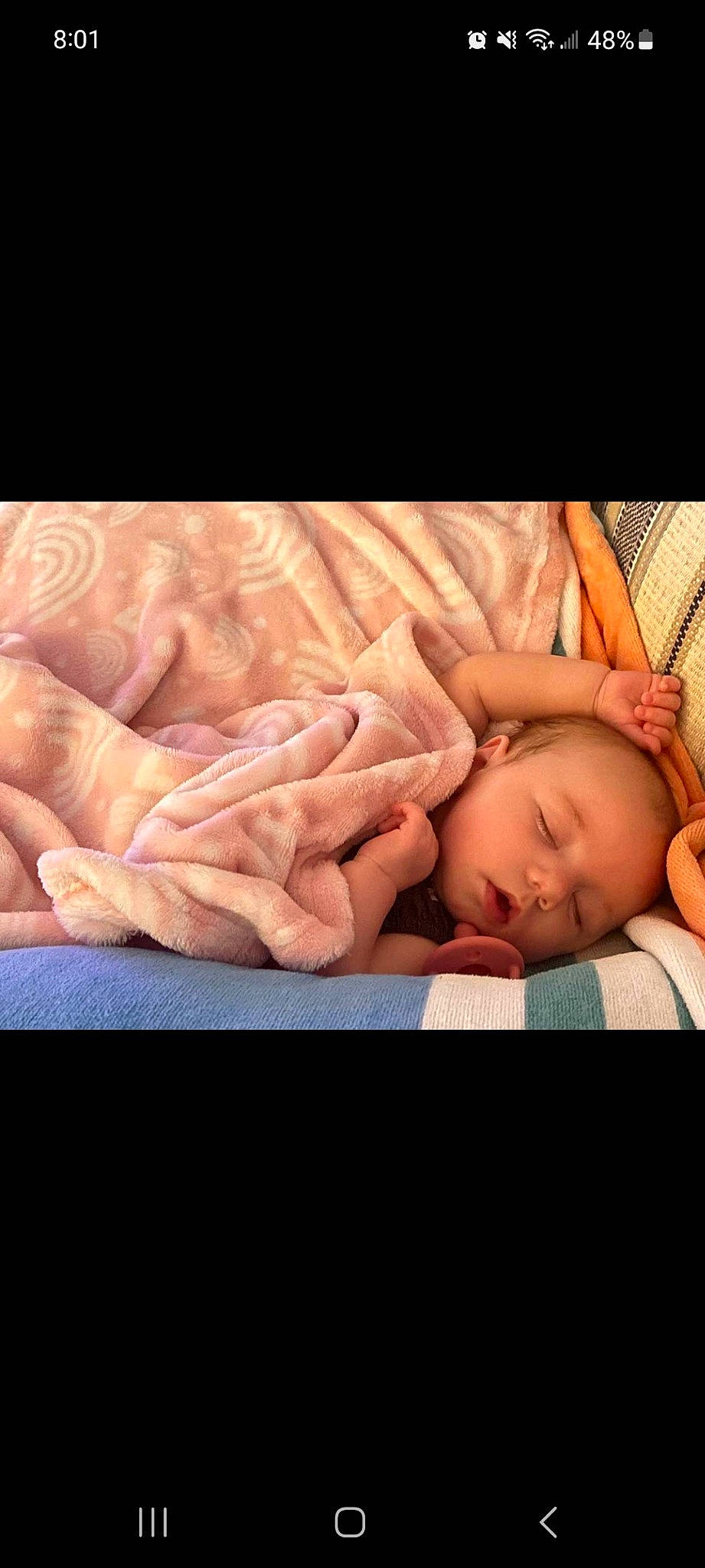 Esme is registered to the contest to win money with this photo: abdomen, arm, baby, baby_products, baby_sleeping, baby_toddler_clothing, bedtime, child, comfort, flash_photography, flesh, human_leg, linens, nail, person, sitting, skin, thigh, thumb, toddler