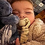 Rose a rejoint le concours — aidez-le/la à gagner de superbes lots ! baby, blanket, child, close_up, clothing, comfort, cozy, cubby_storage, elephant, face, furniture, hand, indoor, nursery, pacifier, peaceful, plush_toy, sleeping, soft_texture, warm_lighting