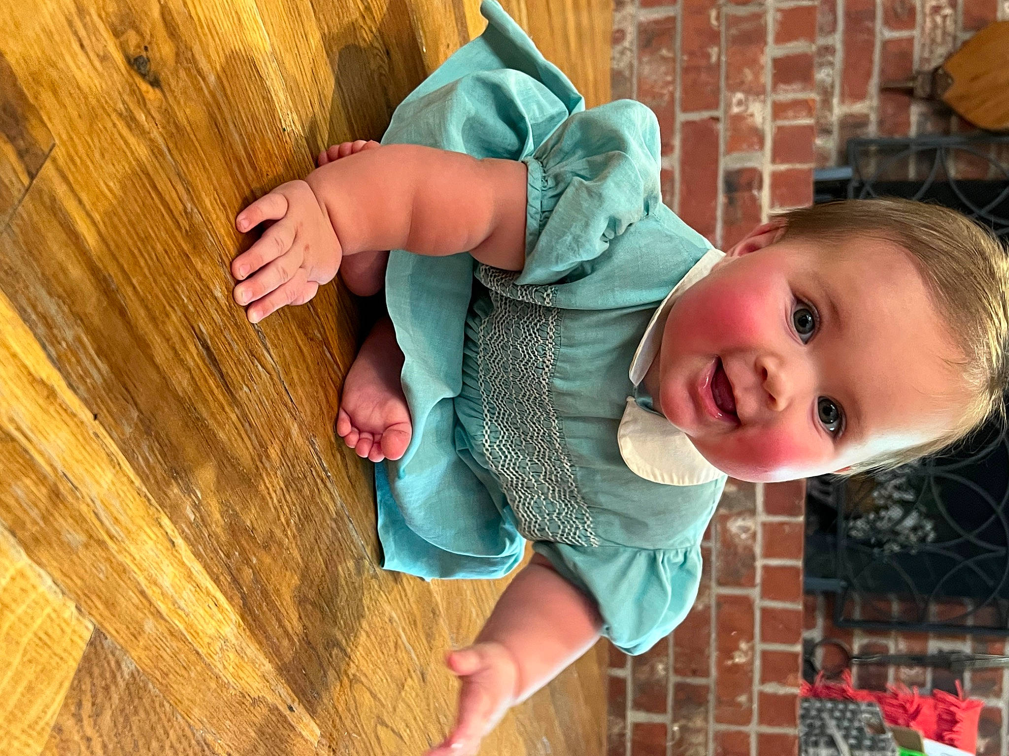 Forrest is registered to the contest to win money with this photo: arm, baby, baby_toddler_clothing, child, flooring, fun, grass, happy, hardwood, human_body, leaf, leisure, pattern, person, photograph, sitting, skin, smile, toddler, tree