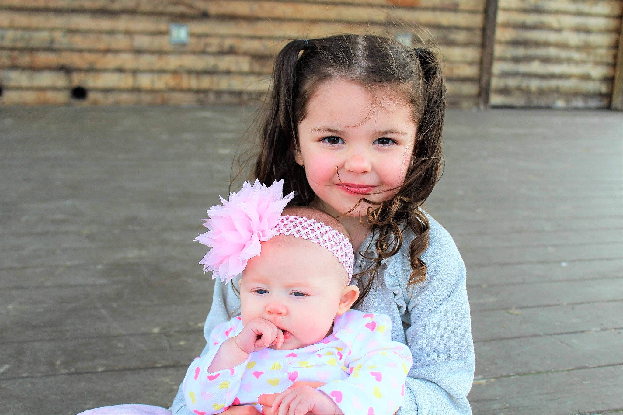 Avalynn is registered to the contest to win money with this photo: baby, baby_toddler_clothing, child, daughter, face, family, happy, head, iris, joy, people, person, photography, pink, sibling, skin, smile, toddler, vacation