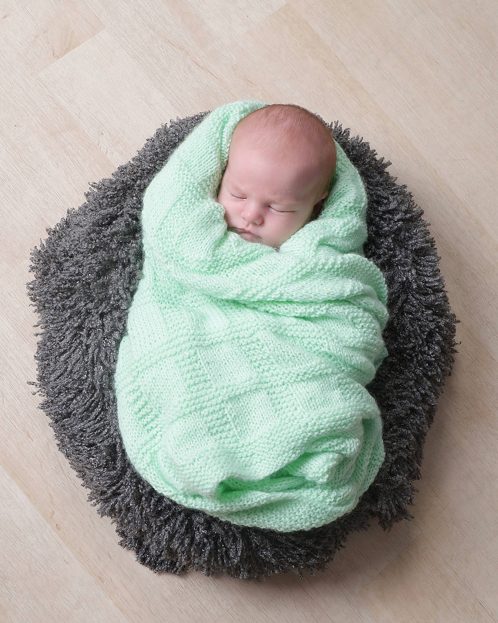 Carter joined the competition — help win amazing prizes! art, baby, baby_products, baby_sleeping, baby_toddler_clothing, beanie, cap, child, comfort, fashion_accessory, flooring, grey, knit_cap, linens, nap, person, sitting, thread, toddler, wool