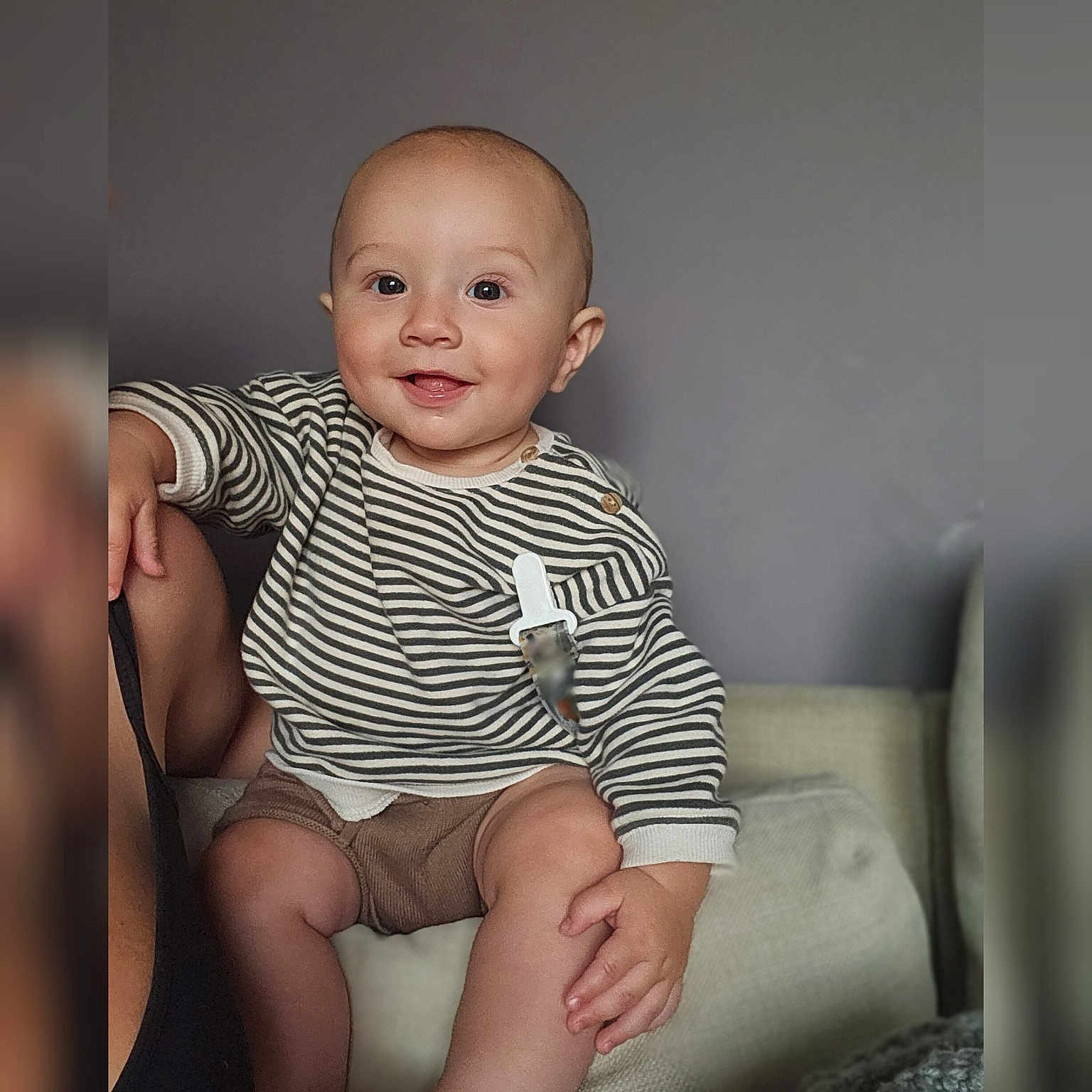 Ezri joined the competition — help win amazing prizes! baby, bodypart, clothing, couch, cushion, face, finger, furniture, hand, happy, head, homedecor, newborn, person, photography, portrait, shorts, sitting, smile, t_shirt