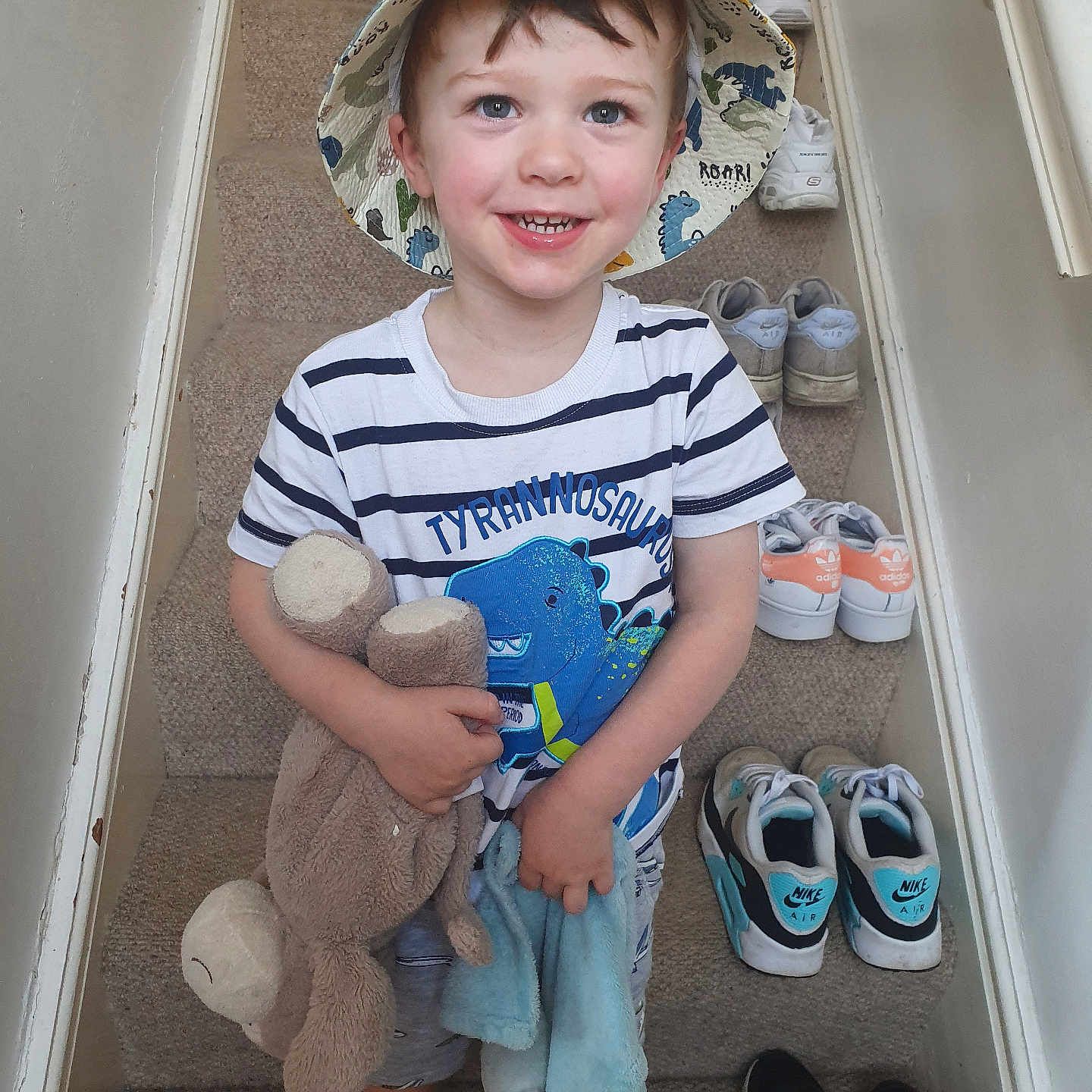 Louie is registered to the contest to win money with this photo: baseballcap, boy, cap, child, clothing, face, footwear, hat, head, male, pants, person, photography, portrait, runningshoe, shoe, shorts, sneaker, teddybear, toy