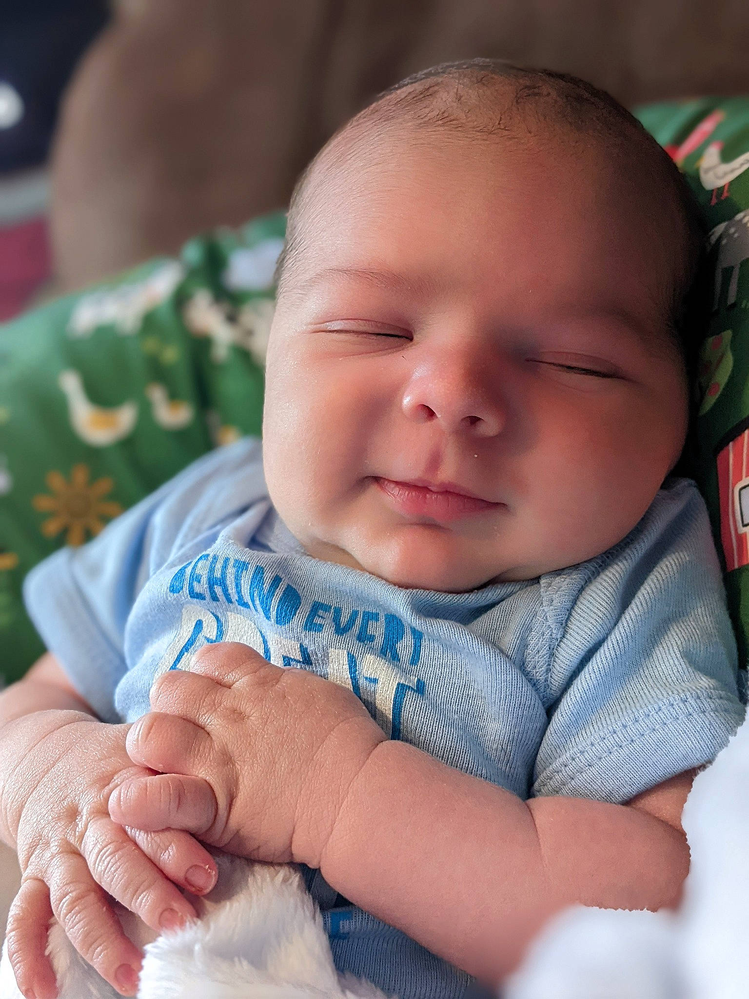 Kholson is registered to the contest to win money with this photo: baby, baby_toddler_clothing, cheek, child, chin, comfort, eye, face, finger, gesture, grass, hand, happy, head, iris, nose, person, skin, textile, thumb