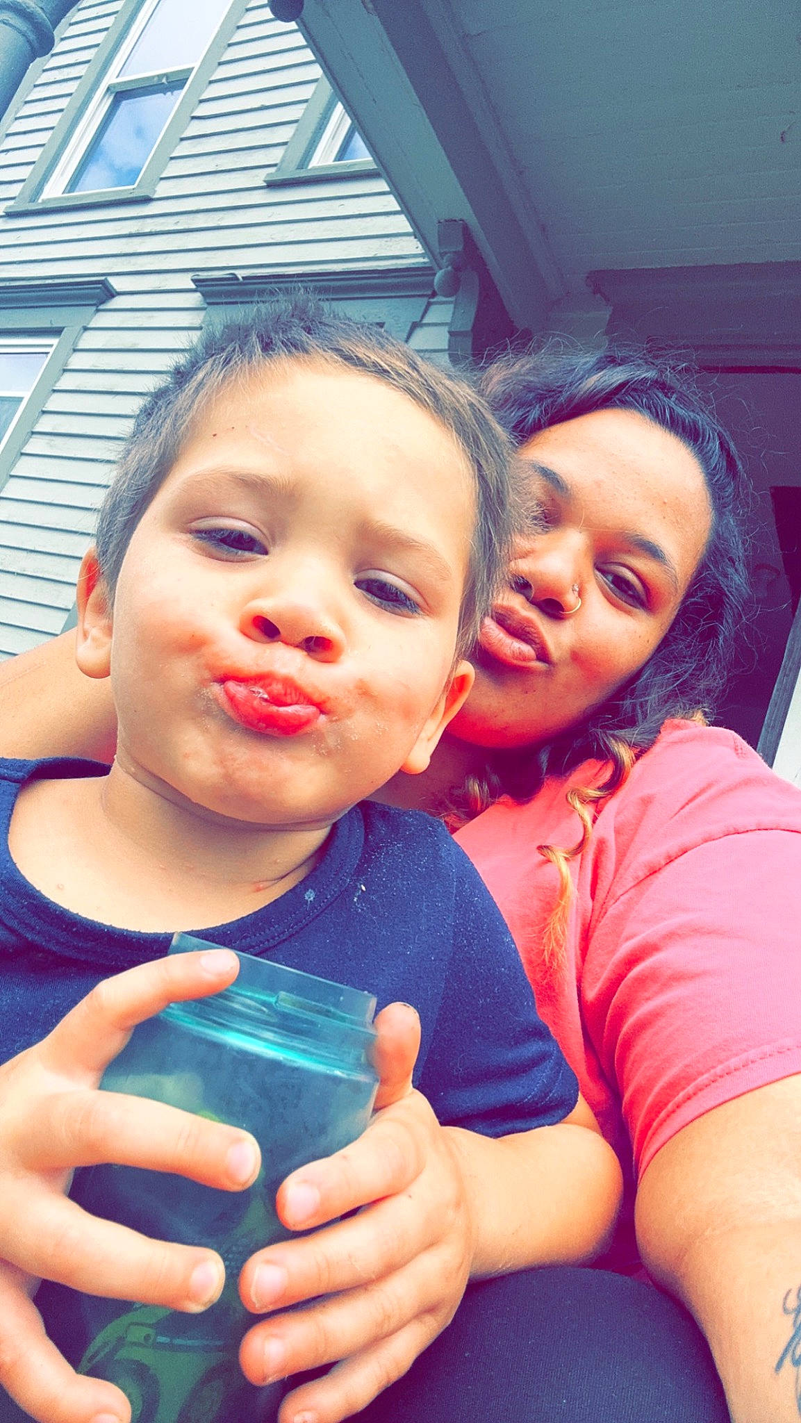 Preston is registered to the contest to win money with this photo: blue, child, dress, drink, drinking, drinkware, finger, fun, gesture, happy, leisure, mouth, nail, nose, person, plastic_bottle, play, skin, tableware, toddler