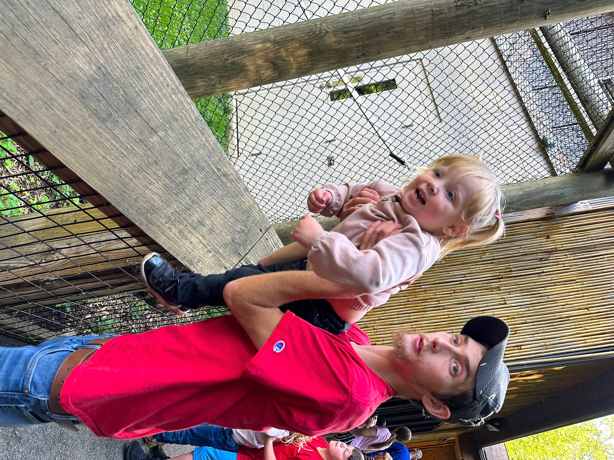 Kalani is registered to the contest to win money with this photo: baby, child, city, fun, grass, happy, headwear, leisure, mesh, person, play, recreation, sandal, shorts, sitting, smile, sock, t_shirt, thigh, toddler