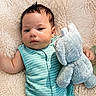 Mason joined the competition — help win amazing prizes! baby, infant, plush_toy, elephant_toy, striped_clothing, blanket, soft_texture, flowers, greenery, closeup, portrait, resting, cute, child, toddler, indoor, comfort, relaxation, skin, smiling_face