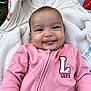 baby, baby_girl, blanket, child, clothing, cozy, cute, expression, face, grass, happy, infant, infant_girl, outdoor, pink_clothing, playful, portrait, smiling, soft_texture, tongue_out