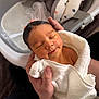 newborn, baby, towel, hands, bath, infant, smile, sleeping, cute, skin, person, white, soft, comfort, cushion, star_pattern, water, parent, closeup, indoors