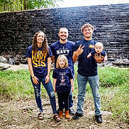 Kaia joined the competition — help win amazing prizes! family, group, outdoor, nature, grass, stone_wall, smiling, child, baby, young_adult, casual_clothing, jeans, footwear, curly_hair, long_hair, short_hair, standing, posing, happy, people