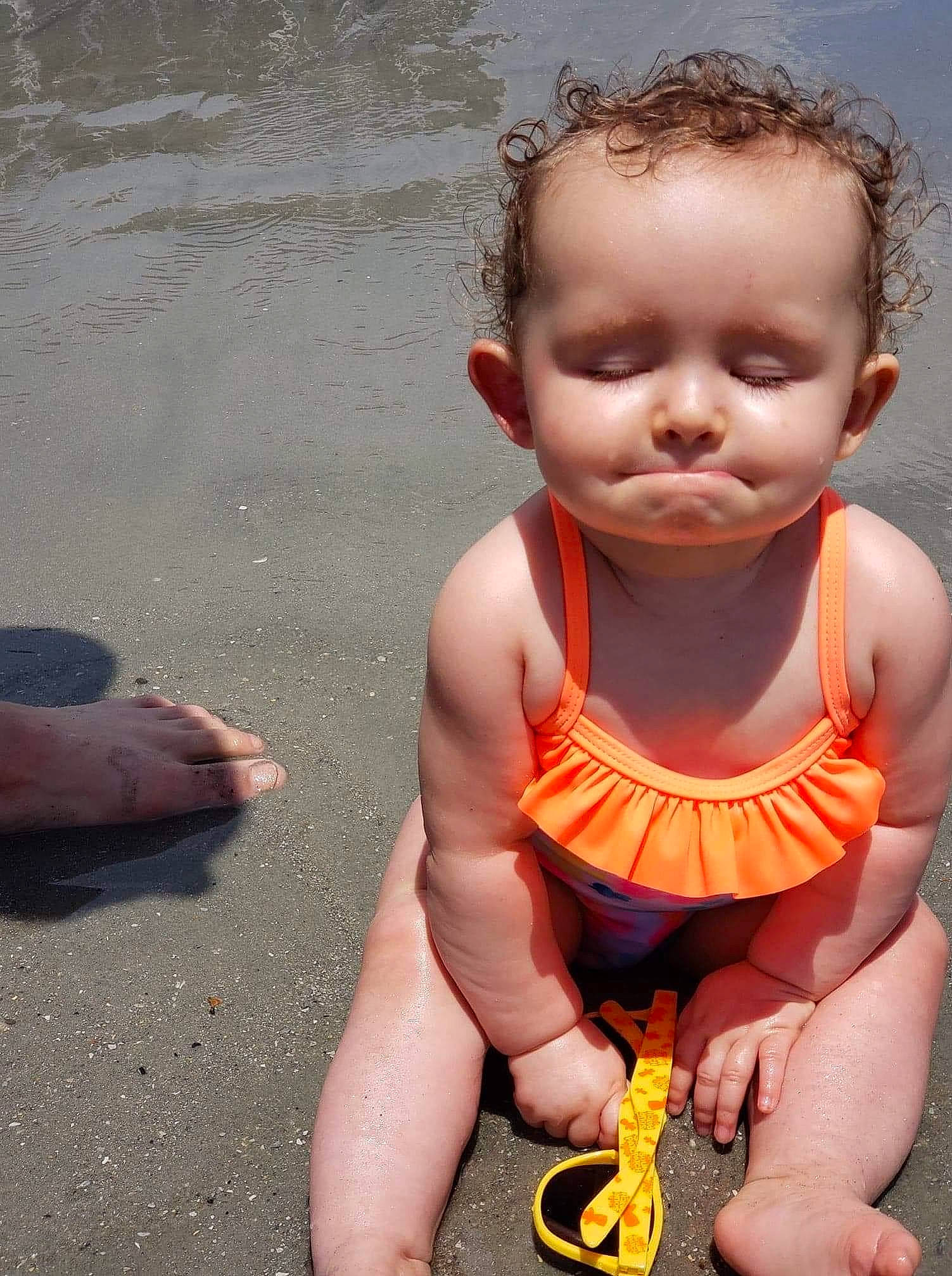 Ava joined the competition — help win amazing prizes! baby, baby_products, baby_toddler_clothing, bathing, beach, chest, child, finger, foot, fun, grass, happy, mouth, nail, people_in_nature, person, sitting, thumb, toddler, vacation