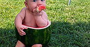 Tyler joined the competition — help win amazing prizes! baby, barefoot, child, cute, fence, food, fresh, fruit, grass, green, happy, nature, outdoor, playful, portrait, sitting, snack, summer, sunlight, watermelon