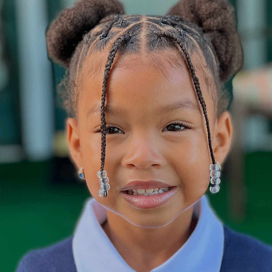 Nylah Arya is registered to the contest to win money with this photo: beads, braids, child, collared_shirt, cute, eyes, face, fashion, girl, hairstyle, happy, headshot, outdoor, person, portrait, skin, smile, sweater, young, young_child