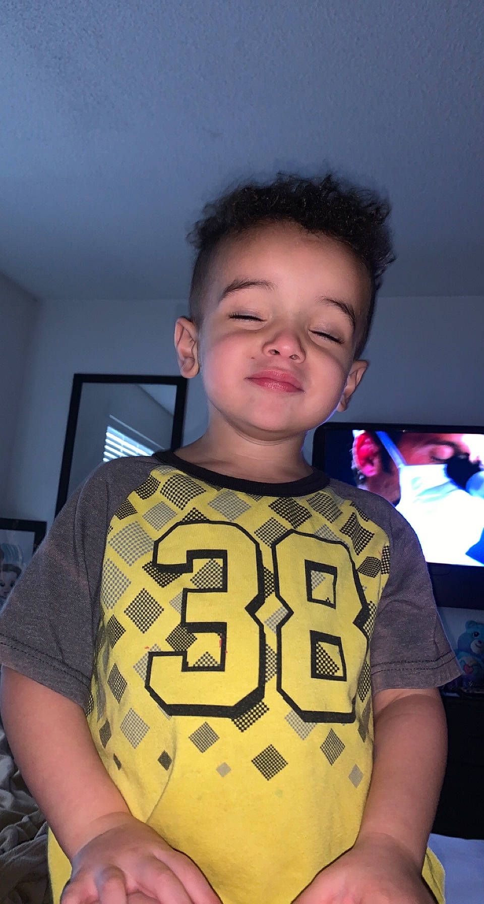 Keaton is registered to the contest to win money with this photo: active_shirt, chest, child, electric_blue, eyebrow, eyewear, fashion_design, flash_photography, forehead, fun, happy, pattern, person, personal_protective_equipment, sleeve, smile, sportswear, t_shirt, toddler, top