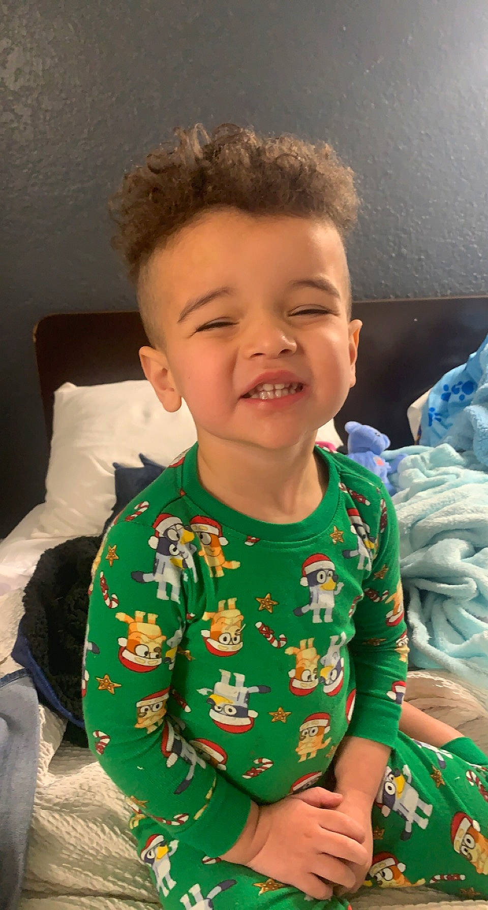 Keaton is registered to the contest to win money with this photo: baby_toddler_clothing, cheek, cool, eye, face, facial_expression, finger, gesture, hair, hairstyle, happy, head, mouth, neck, nose, person, skin, sleeve, smile, standing