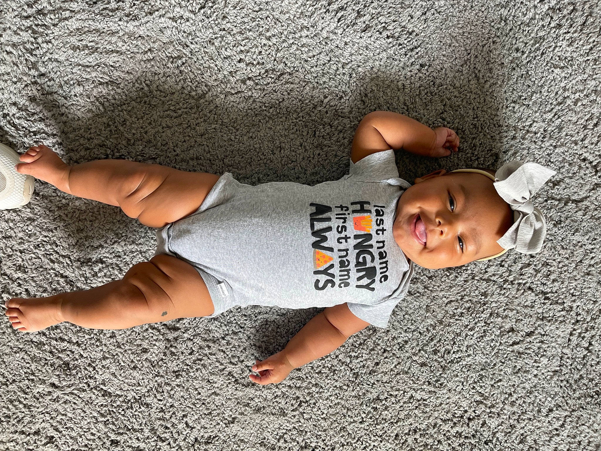 Lennox joined the competition — help win amazing prizes! child, comfort, elbow, flooring, foot, fun, grass, hat, headwear, human, human_body, human_leg, joint, knee, leg, leisure, person, sleeve, t_shirt, thigh