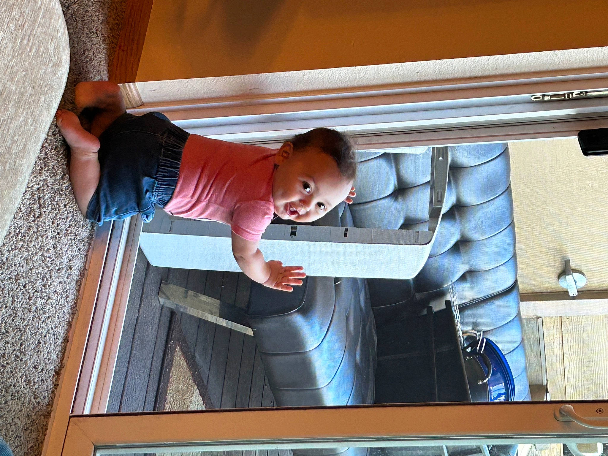 Justin is registered to the contest to win money with this photo: aluminium, automotive_exterior, baby, baby_toddler_clothing, child, composite_material, fun, hat, person, t_shirt, toddler, vehicle_door, wood