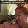 Luna is registered to the contest to win money with this photo: affection, bird_ornament, blinds, cat, closeup, decoration, gray_cat, home, indoors, kissing, person, pet, portrait, selfie, shoulder, tabby, text_overlay, wall, window, woman