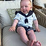 baby, chair, child, clothing, cushion, cute, decor, face, foot, furniture, hand, happy, indoor, infant, person, sailor_outfit, shorts, skin, sleeve, smiling