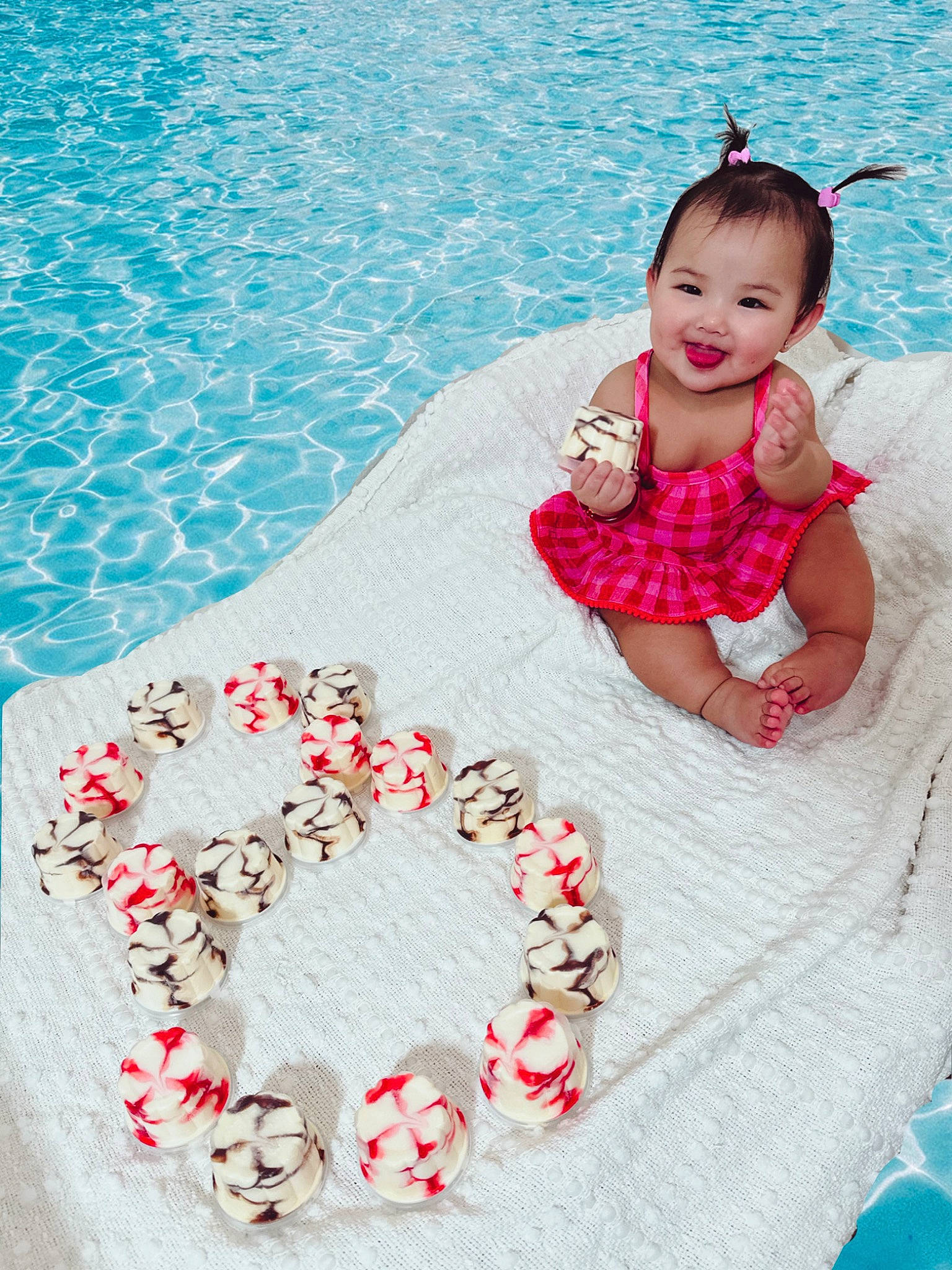 Anaya is registered to the contest to win money with this photo: beauty, blue, child, dress, event, fashion_accessory, flooring, formal_wear, fun, happy, human_body, joy, leisure, pattern, person, petal, pink, smile, swimming_pool, textile